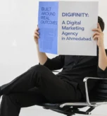 Person holding a magazine highlighting Digifinity as a digital marketing agency in Ahmedabad.