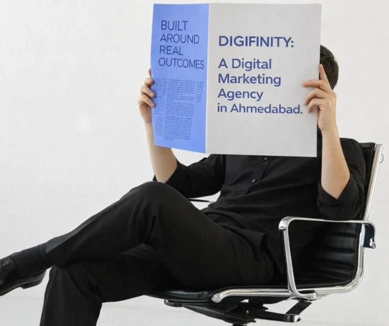 Person holding a magazine highlighting Digifinity as a digital marketing agency in Ahmedabad.