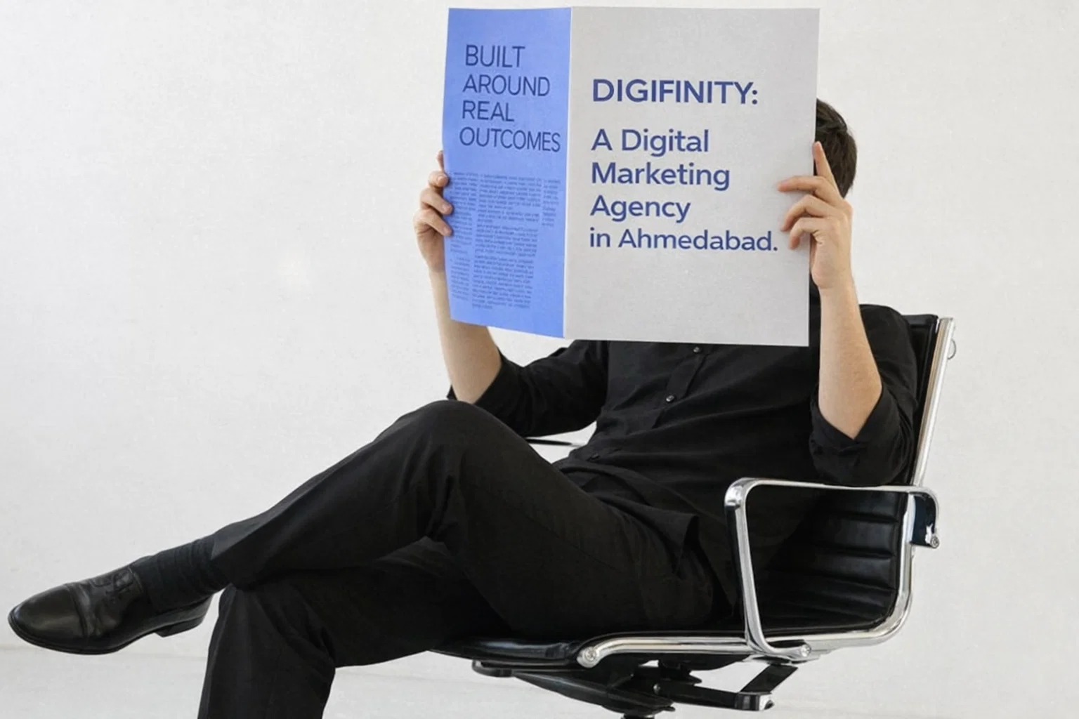 Person holding a magazine highlighting Digifinity as a digital marketing agency in Ahmedabad.