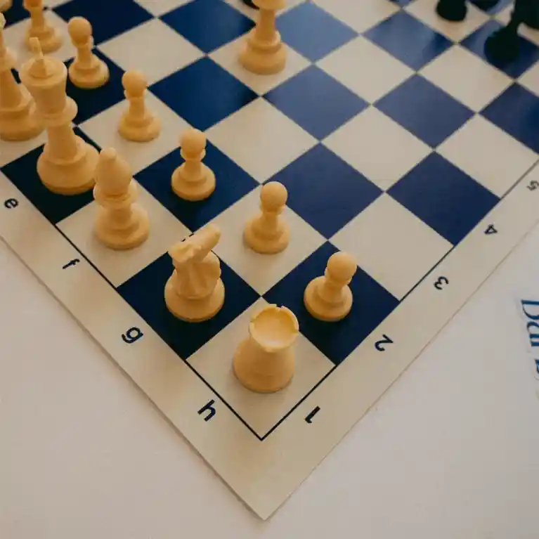 Chess board with pieces arranged for a strategic game.